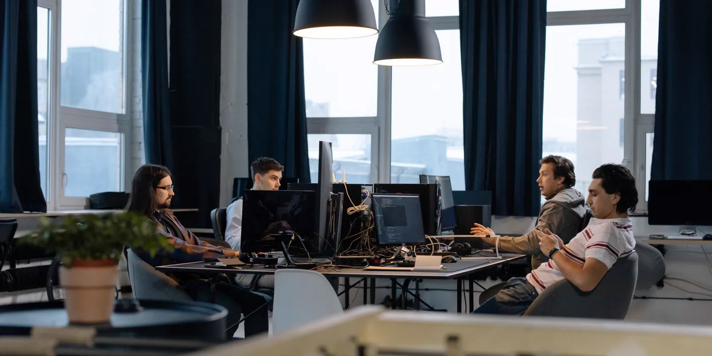 An engineering floor of developers working at their workstations